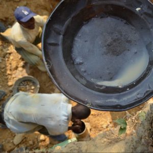 mining plate with miners in the background