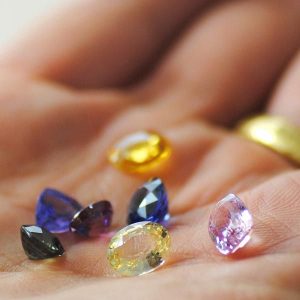 Multicolored Pavé Jewelry Sapphires held in a hand