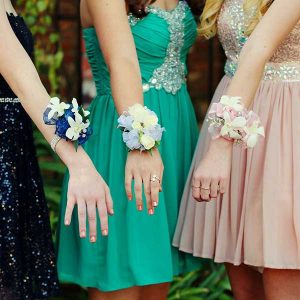 Prom goers with corsages via Pixabay